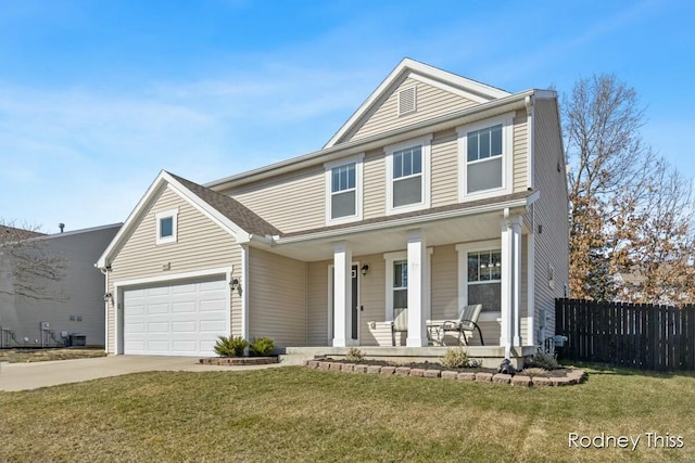 traditional home with a front lawn, a garage, fence, and covered porch