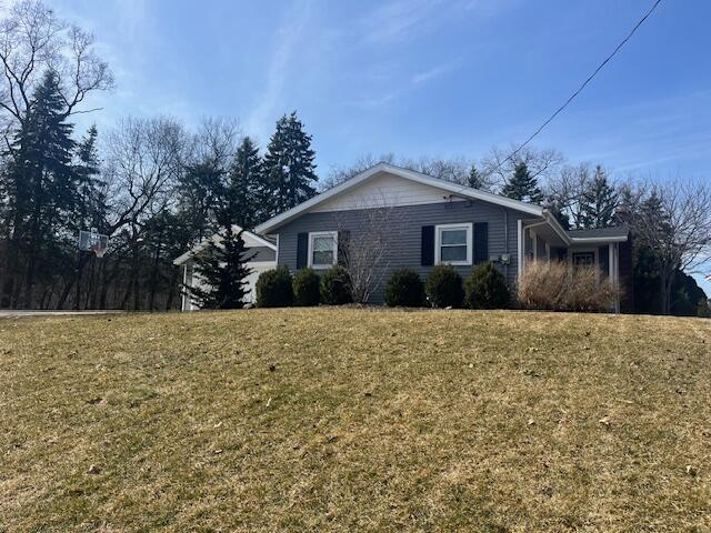 view of home's exterior featuring a lawn