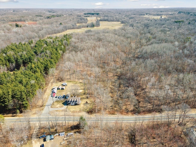 birds eye view of property featuring a rural view and a forest view