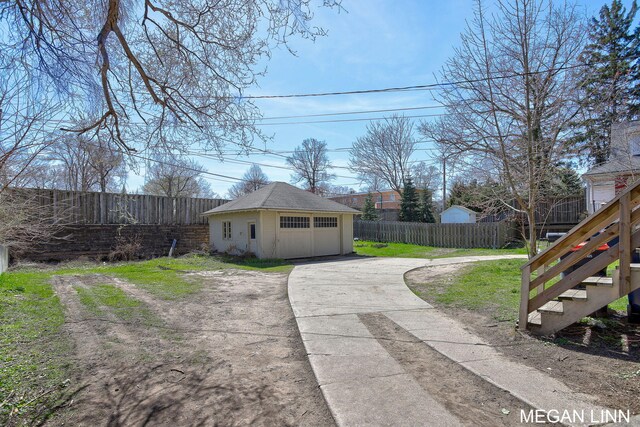 186 W 12th St, Holland, MI 49423 - exterior space with an outbuilding, a lawn, stairs, and fence private yard