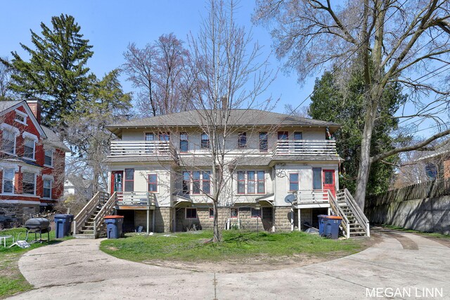 186 W 12th St, Holland, MI 49423 - exterior space with fence, stairway, and a balcony