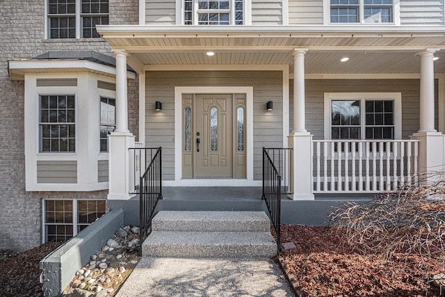 property entrance with covered porch