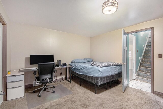 carpeted bedroom with baseboards