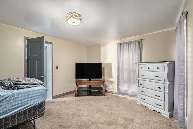 bedroom featuring baseboards and carpet floors