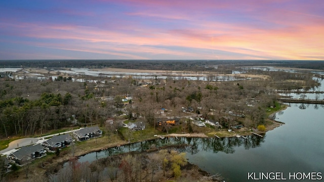 aerial view at dusk with a water view