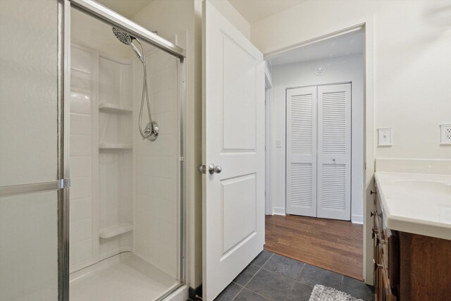 111 N Ashley St Unit 510, Ann Arbor, MI 48104 - bathroom with tile patterned floors, vanity, and a shower stall