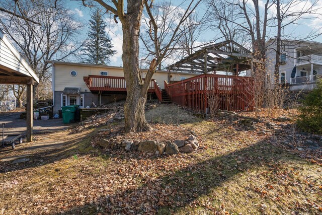 view of yard featuring a wooden deck and stairway