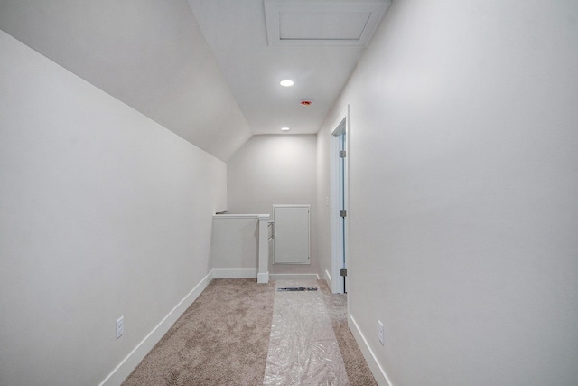 609 Lincoln Ave NW, Grand Rapids, MI 49504 - corridor featuring light colored carpet, an upstairs landing, vaulted ceiling, recessed lighting, and attic access