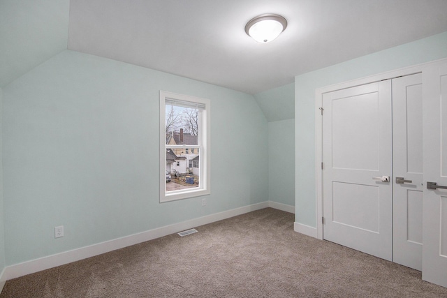 609 Lincoln Ave NW, Grand Rapids, MI 49504 - additional living space with lofted ceiling and carpet