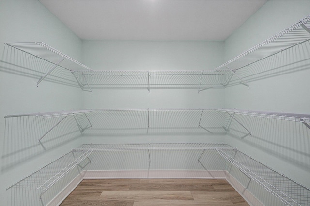 609 Lincoln Ave NW, Grand Rapids, MI 49504 - spacious closet featuring wood finished floors