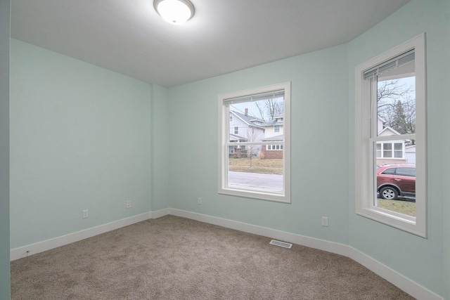 609 Lincoln Ave NW, Grand Rapids, MI 49504 - spare room featuring light colored carpet