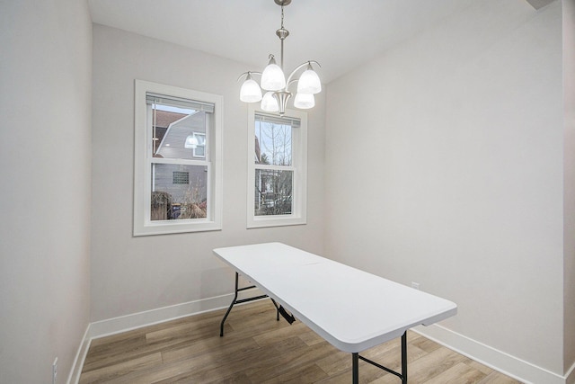 609 Lincoln Ave NW, Grand Rapids, MI 49504 - office space with light wood-style floors and a chandelier