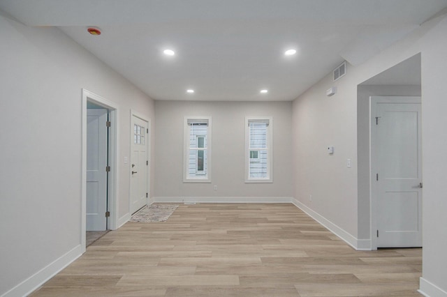 609 Lincoln Ave NW, Grand Rapids, MI 49504 - spare room featuring light wood-style flooring and recessed lighting