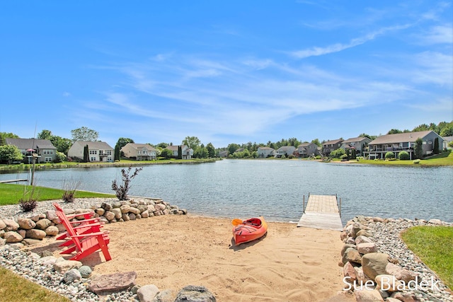 6735 Windflower Way, Norton Shores, MI 49444 - water view with nearby suburban area and a boat dock
