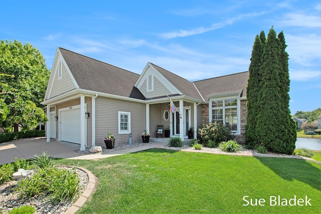 6735 Windflower Way, Norton Shores, MI 49444 - view of front of property featuring driveway, a front lawn, roof with shingles, and a garage