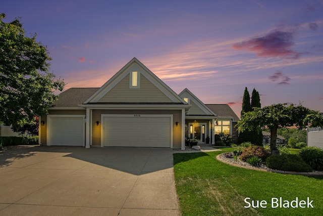 6735 Windflower Way, Norton Shores, MI 49444 - view of front of house with an attached garage, a yard, and driveway