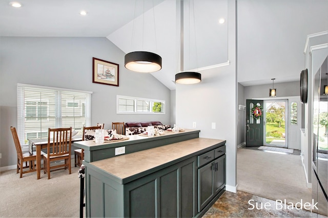 6735 Windflower Way, Norton Shores, MI 49444 - kitchen with light carpet, high vaulted ceiling, recessed lighting, light countertops, and a peninsula