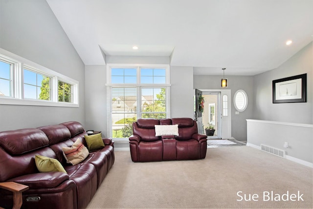 6735 Windflower Way, Norton Shores, MI 49444 - carpeted living area featuring lofted ceiling and recessed lighting