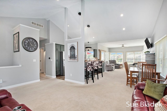 6735 Windflower Way, Norton Shores, MI 49444 - living area featuring light colored carpet, ceiling fan, high vaulted ceiling, and recessed lighting