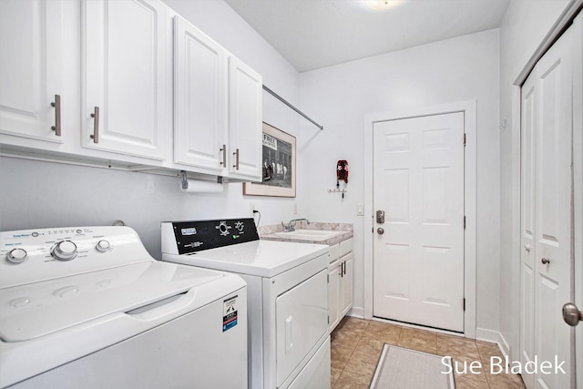 6735 Windflower Way, Norton Shores, MI 49444 - laundry area with washer and dryer, cabinet space, and light tile patterned flooring