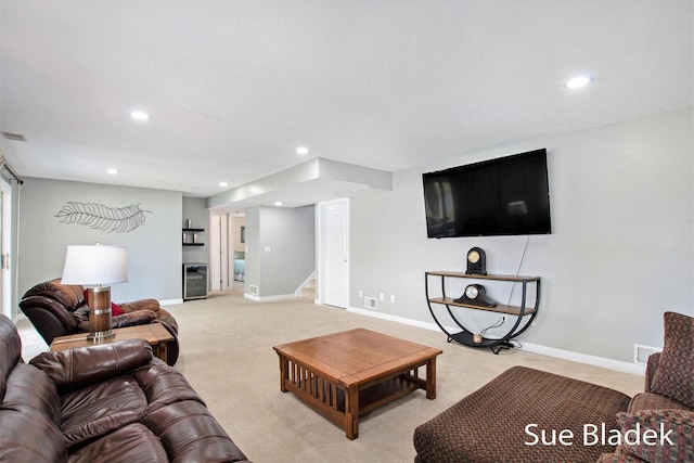 6735 Windflower Way, Norton Shores, MI 49444 - living area featuring stairway, light carpet, and recessed lighting