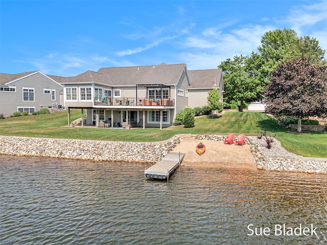 6735 Windflower Way, Norton Shores, MI 49444 - rear view of property featuring a lawn and a deck with water view