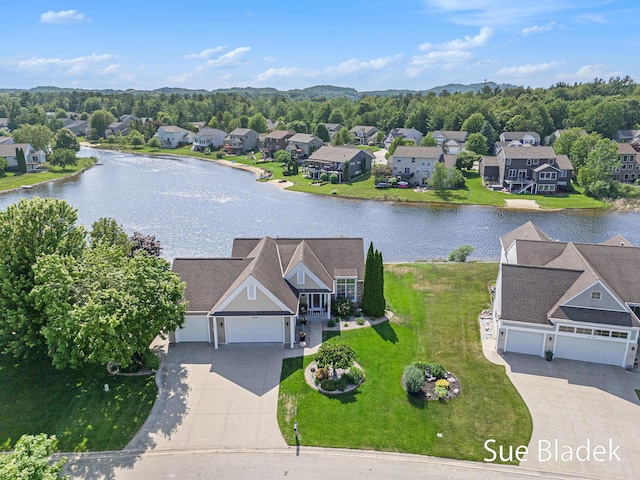 6735 Windflower Way, Norton Shores, MI 49444 - aerial perspective of suburban area featuring a nearby body of water