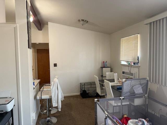 carpeted office featuring baseboards and a wall unit AC