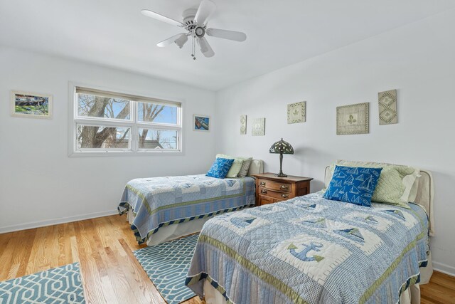 2019 Silvertip Ln, Long Beach, IN 46360 - bedroom featuring a ceiling fan, baseboards, and wood finished floors