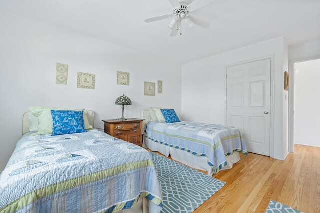2019 Silvertip Ln, Long Beach, IN 46360 - bedroom with baseboards, ceiling fan, and wood finished floors