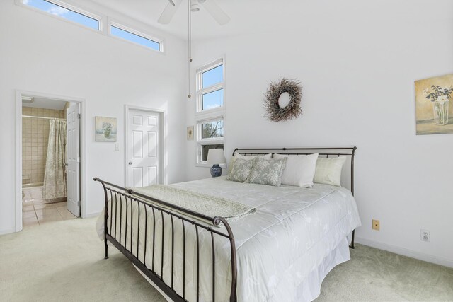 2019 Silvertip Ln, Long Beach, IN 46360 - bedroom with baseboards, carpet, a towering ceiling, and ensuite bathroom