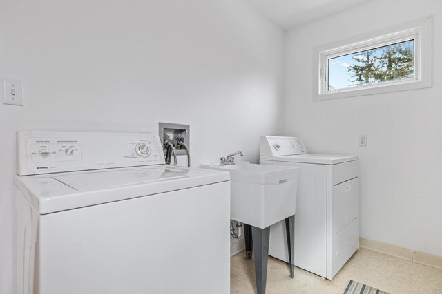 2019 Silvertip Ln, Long Beach, IN 46360 - laundry room with laundry area, baseboards, and independent washer and dryer