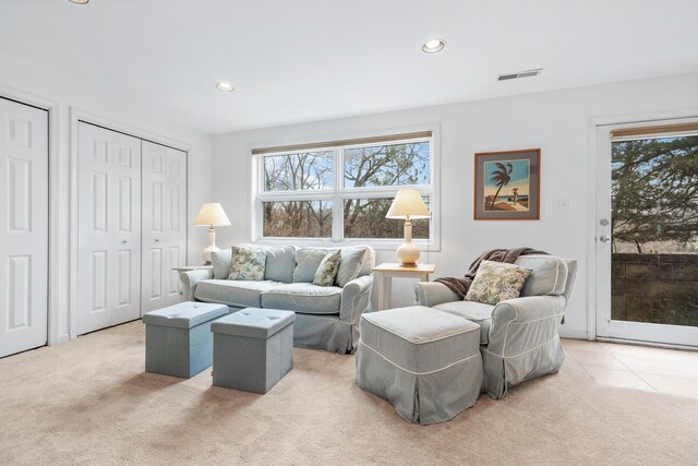 2019 Silvertip Ln, Long Beach, IN 46360 - living room with light carpet, visible vents, recessed lighting, and light tile patterned floors