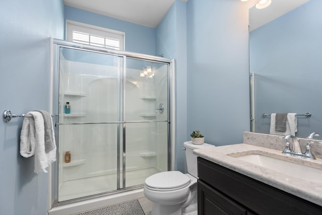 6337 S Trailwoods Dr, Ann Arbor, MI 48103 - full bath featuring a stall shower, toilet, and vanity