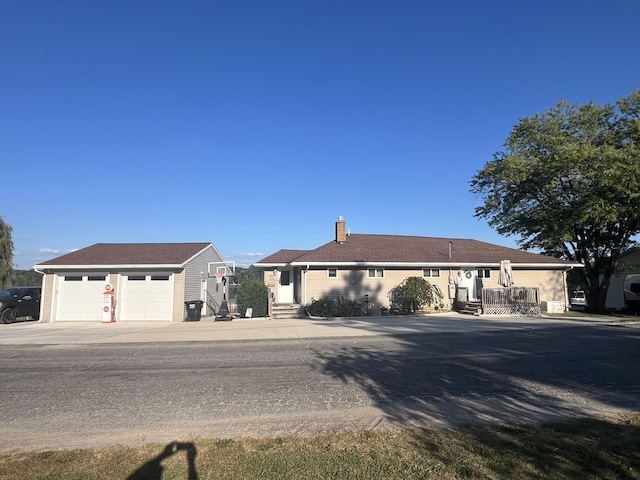 2772 S Wisner Ave, Fremont, MI 49412 - ranch-style house with a chimney and a detached garage