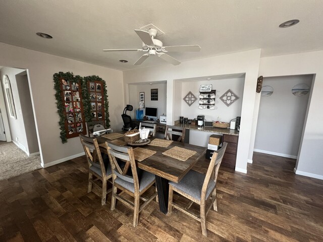 2772 S Wisner Ave, Fremont, MI 49412 - dining room with baseboards, dark wood-type flooring, and a ceiling fan
