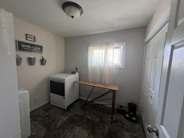2772 S Wisner Ave, Fremont, MI 49412 - laundry room featuring laundry area, washer / dryer, and baseboards