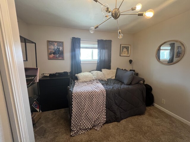 2772 S Wisner Ave, Fremont, MI 49412 - carpeted bedroom featuring a chandelier and baseboards
