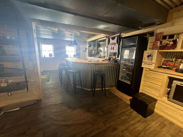 2772 S Wisner Ave, Fremont, MI 49412 - bar with a bar and dark wood-style flooring