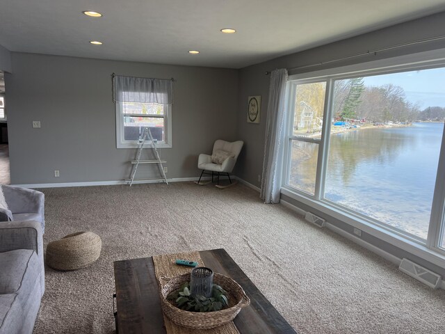 2772 S Wisner Ave, Fremont, MI 49412 - sitting room with recessed lighting, visible vents, baseboards, and carpet