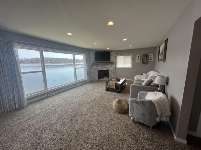 2772 S Wisner Ave, Fremont, MI 49412 - carpeted living area featuring plenty of natural light, a fireplace, recessed lighting, and baseboards
