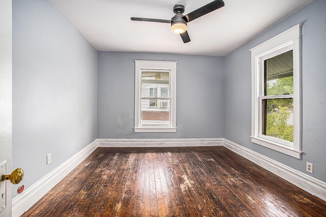 176 N Union St, Battle Creek, MI 49017 - unfurnished room with dark wood-style floors, baseboards, and ceiling fan