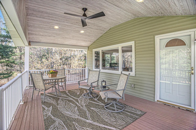 wooden terrace featuring a ceiling fan