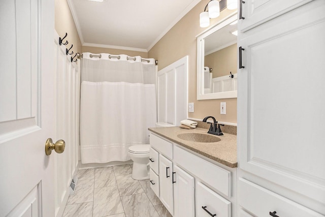 bathroom featuring marble finish floors, crown molding, vanity, and toilet