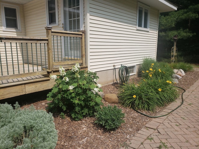 view of home's exterior featuring a deck