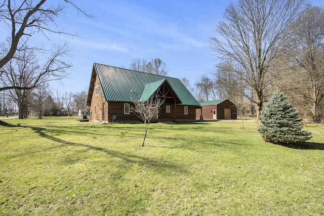 426 Elizabeth St, Buchanan, MI 49107 - view of front of property with a front yard and metal roof