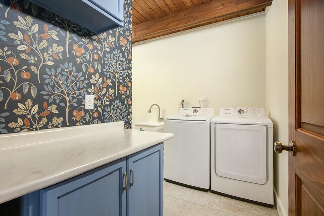 426 Elizabeth St, Buchanan, MI 49107 - laundry area featuring light tile patterned flooring, a sink, washer and dryer, cabinet space, and wood ceiling