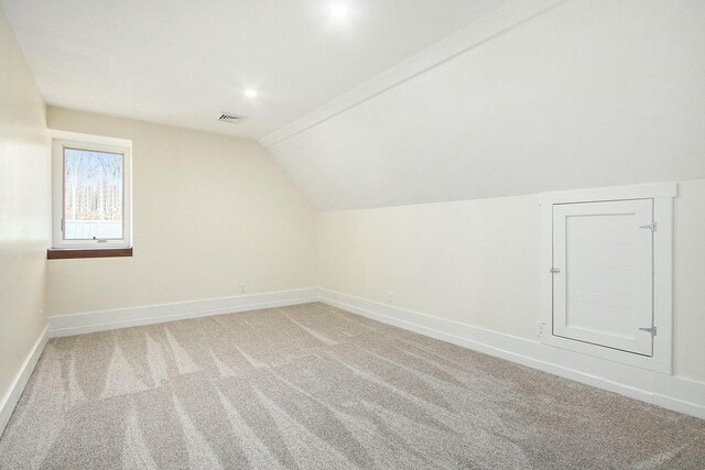 426 Elizabeth St, Buchanan, MI 49107 - bonus room featuring lofted ceiling, light colored carpet, recessed lighting, baseboards, and visible vents