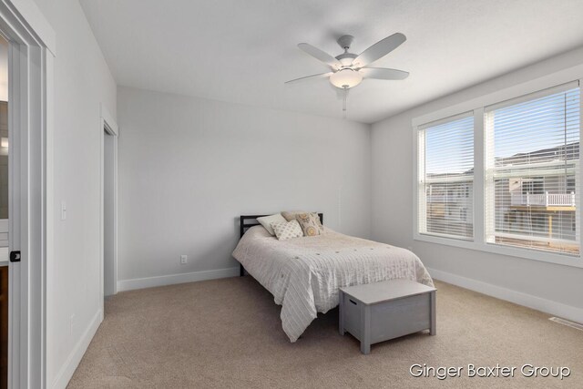 5560 Albright Ave SW Unit 67, Wyoming, MI 49418 - bedroom with a ceiling fan, baseboards, light colored carpet, and visible vents
