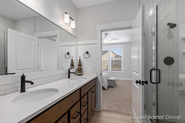 5560 Albright Ave SW Unit 67, Wyoming, MI 49418 - ensuite bathroom featuring a stall shower, a sink, and a ceiling fan